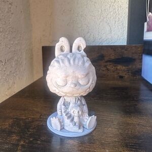 Almost hidden series grey figurine